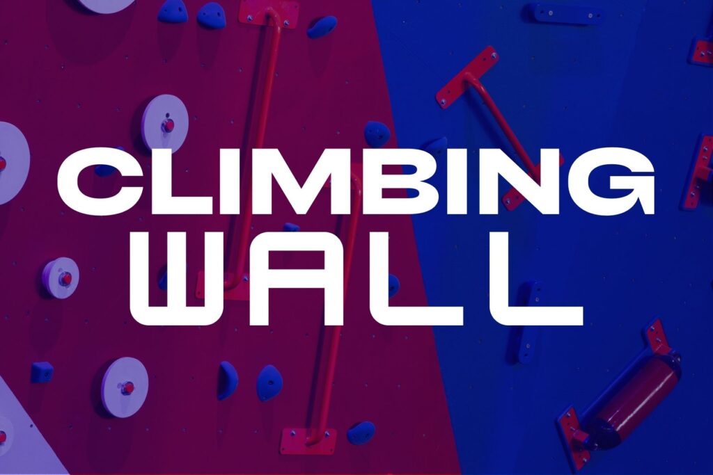 Climbing wall at The Rush Funplex, touted as the best climbing wall in the UK, featuring various routes for all skill levels.