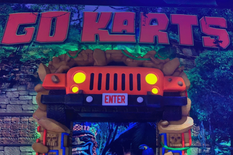 Go karts racing at The Rush Funplex, the world's largest indoor theme park, with colorful tracks and excited riders.