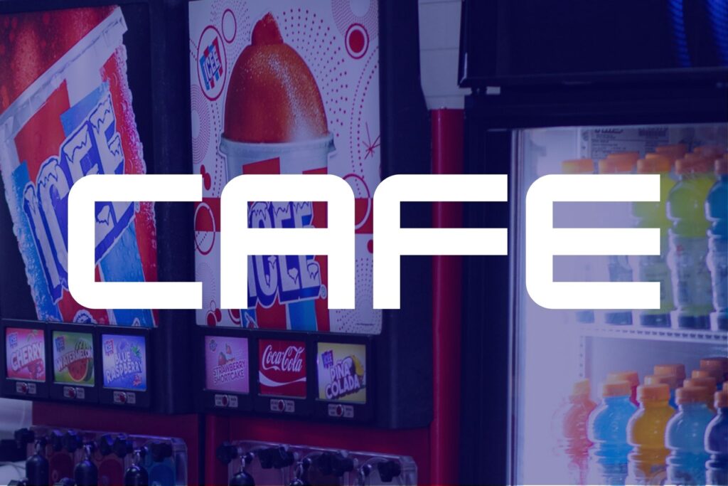 Café setting at The Rush Funplex, showcasing a modern workspace with people collaborating and enjoying coffee.